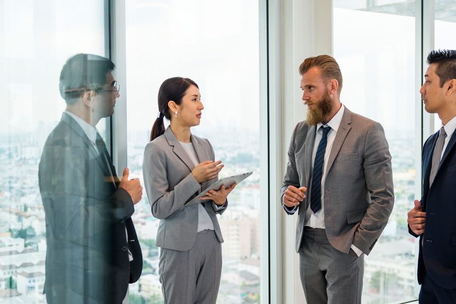 business-people-talking-and-discussing-corporate-p-X5TTR6U.jpg