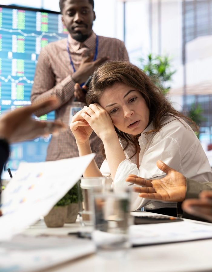 female-general-manager-trying-handle-organizational-crisis-meeting_482257-122864